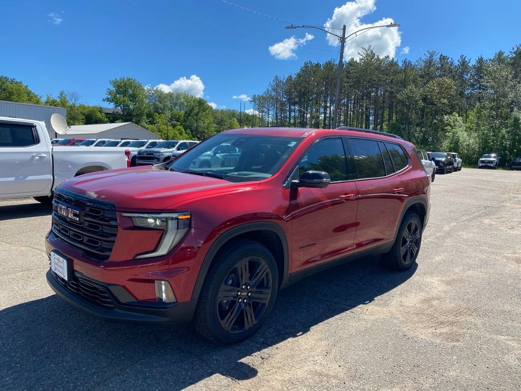2026 GMC Acadia Elevation in Volcanic Red Tintcoat — front three-quarter view